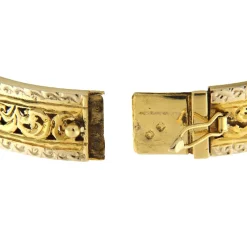 Bracciale rigido in oro giallo e bianco
