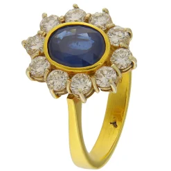 Guidetti | Anello in oro giallo e bianco con zaffiro e contorno di diamanti